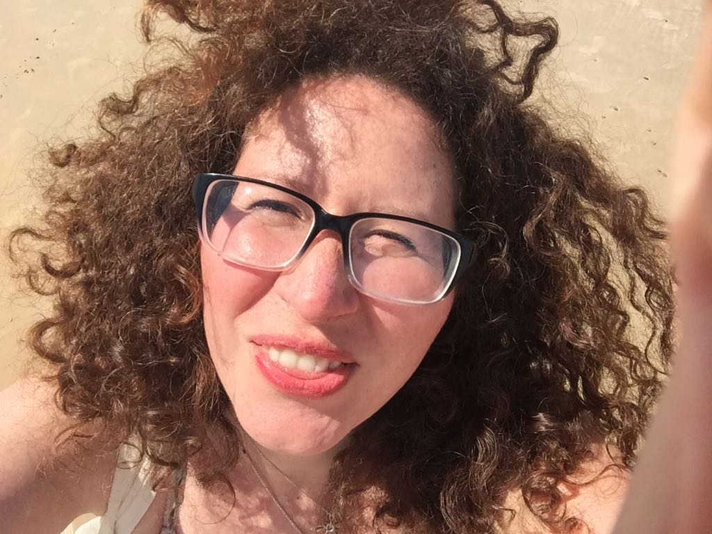 What does a girl with big curly hair pack for a trip: Skincare and grooming&nbsp;products